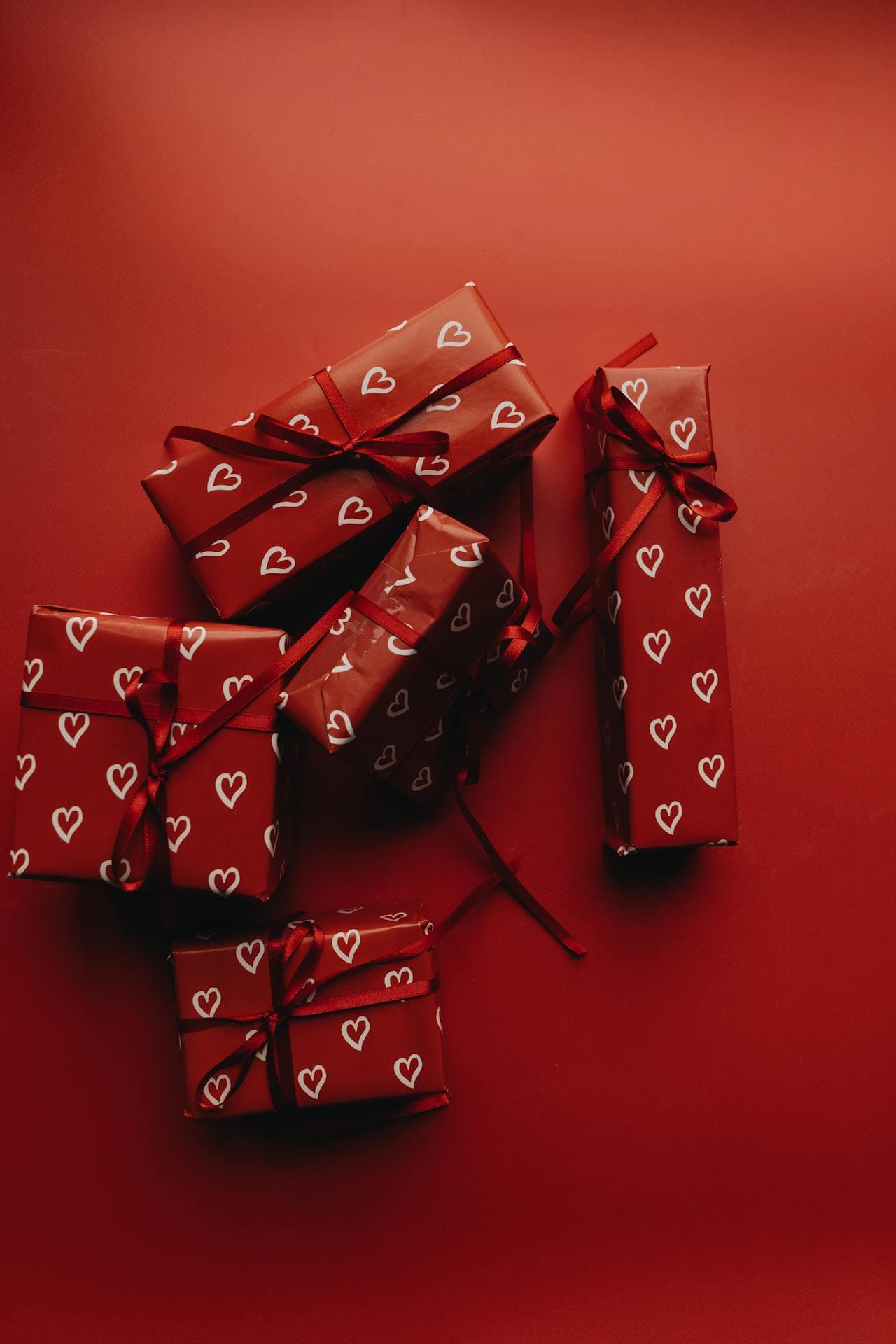 Red gift boxes on red surface